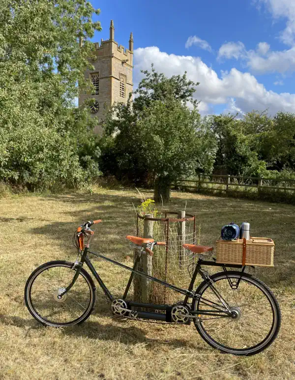 Tandem bicycle with church in background